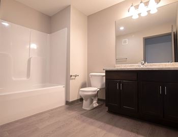 a bathroom with a toilet sink and bathtub